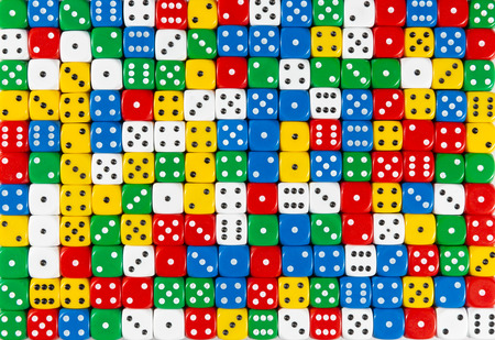 Pattern background of random ordered red, white, yellow, blue and green dices