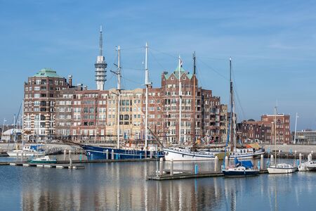 Lelystad, The Netherlands - February 23, 2019: Harbor with communication Tower and modern apartment building in capital city Lelystad of province Flevoland, The Netherlandsのeditorial素材