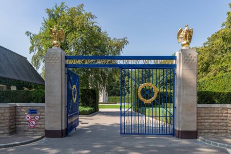Hamm near Luxembourg city, Luxembourg - August 22, 2018: Entrance American WW2 Cemetery with iron gate and gold eaglesのeditorial素材