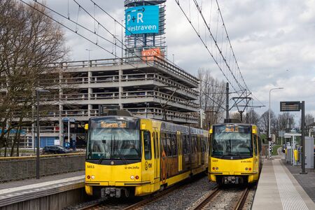 Utrecht, The Netherlands - April 03, 2018: Tram station with trams near park and ride transferium...