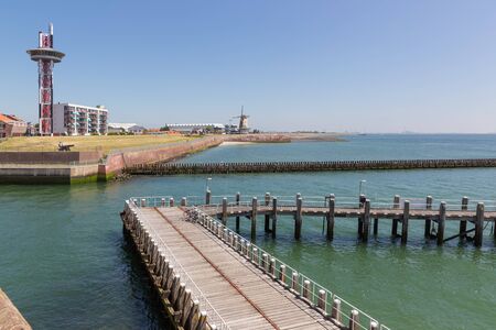 Seascape harbor Dutch city Vlissingen along Westerschelde with wooden jettyの写真素材