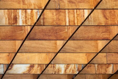 Ceiling background of square wooden timbers painted in brown colors