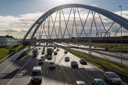 Muiden, The Netherlands - October 03, 2019: Rush hour at Dutch motorway A1 near Amsterdam with...