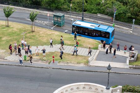 Budapest, Hungary - Juli 13, 2019: Bus and pedestrians on the way to Buda Castle Hill, Budapest,...