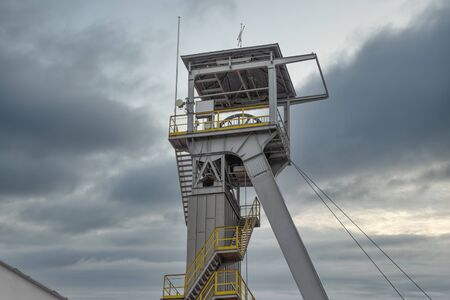 Tower of shaft salt mine Wieliczka near Polish Krakow with a cloudy sky at the background