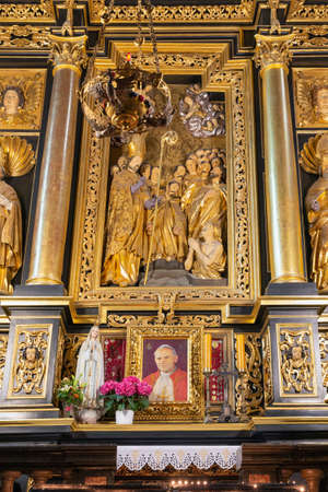 Krakow, Poland - May 13, 2019: Interior St. Marys Basilica in Krakow with portret of pope Johannes...