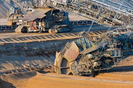 Brown coal open pit landscape with enormous digging excavator in Hambach mine Germany, This machine...