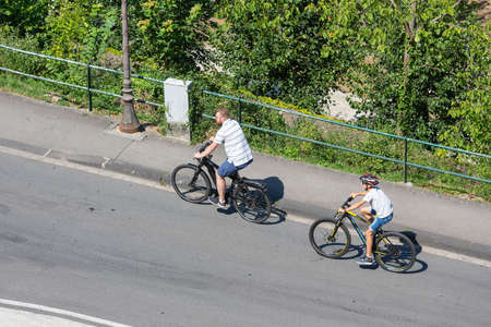 Luxembourg City, Luxembourg - August 18, 2018: Aerial view two cyclists in Luxembourg cityのeditorial素材