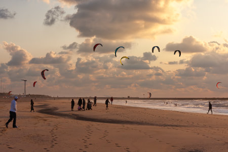 Scheveningen, The Netherlands - September 29, 2008: Kite surfing in the sunset at the beach of Scheveningen, the Netherlandsのeditorial素材