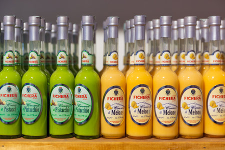 Taormina, Italy - May 23, 2016: Liquor store with display of local bottles liqueurのeditorial素材