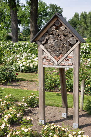 Dutch rose garden with wooden insects hotelの写真素材