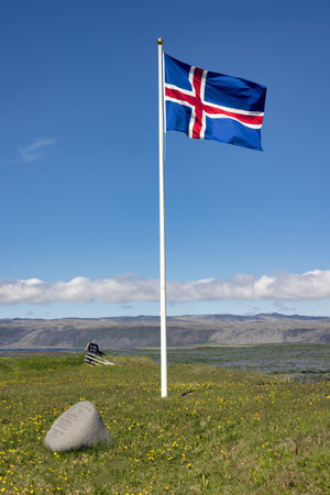 Iceland flag near coast of South Icelandの写真素材