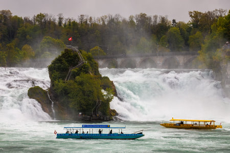 Rhine Falls with tourist boats and central rock viewpointのeditorial素材