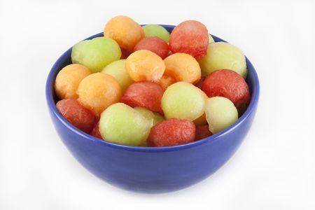 Melon balls in blue bowlの写真素材