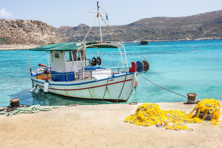 Fisherman boat on the dock on one of the Greek islands.の写真素材