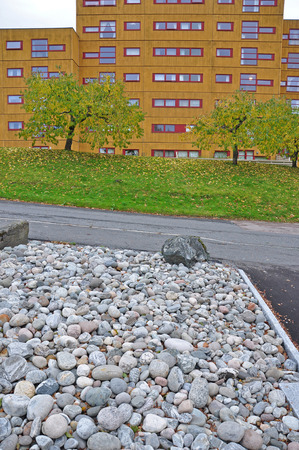 An area with stones on the street in front of the house.の写真素材