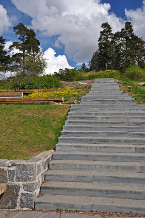 A park with a stone stairway to the horizon.の写真素材
