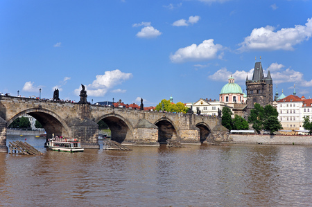 View from the Vltava River to Charles Bridge, the Old Town Tower and the Church of St. Francis of Assisi.の写真素材