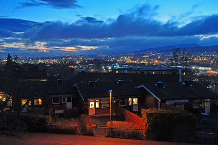 Evening view of Oslo with old historic houses in the foreground and mountains on the horizon. Norway.Europe.のeditorial素材