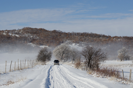 Snowy country roadの写真素材