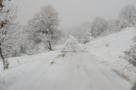 Snowy country roadの写真素材