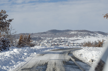 Snowy village roadの写真素材