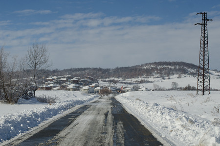 Snowy village roadの写真素材