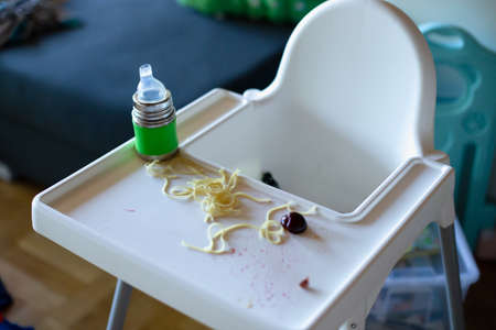 Baby led weaning: messy high chair after a meal. High quality photoの写真素材