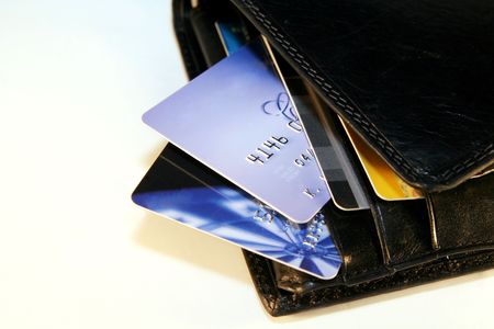 Credit Cards in a black wallet on a light backgroundの写真素材