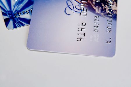 Two colorful credit cards on a light background