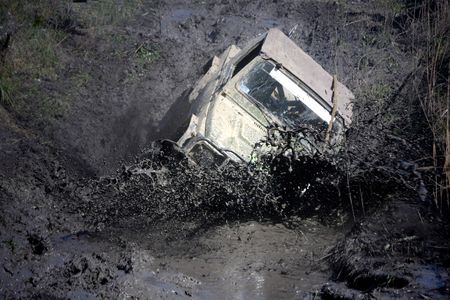 Extreme off-road. Roadster in the big mud