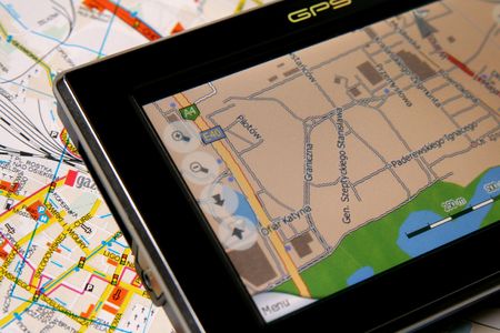 A GPS mobile (navigation device) and old traditional mapの写真素材