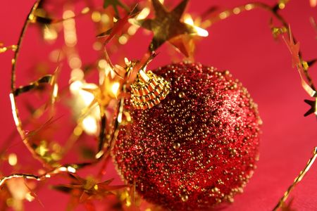 Red-gold Christmas ball with gold ornament starsの写真素材