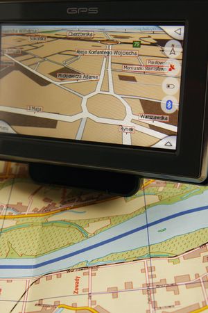 A GPS mobile (navigation device) and old traditional map