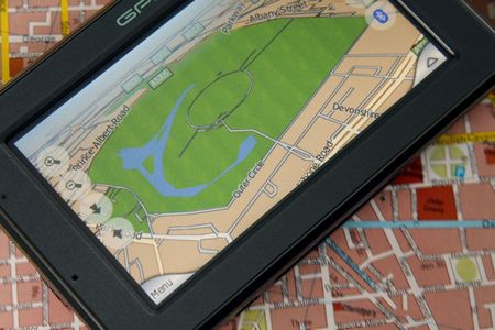 A GPS mobile (navigation device) and old traditional map