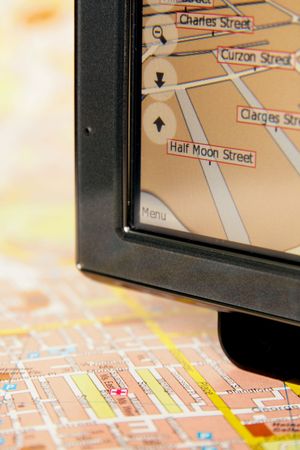 A GPS mobile (navigation device) and old traditional mapの写真素材