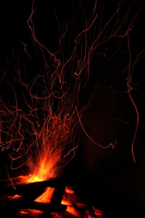 Fire and sparks. Campfire and the sparks at the nightの写真素材