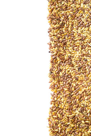 Close up. Mixed seeds gold and brown linseed, flax seed pattern frameの写真素材