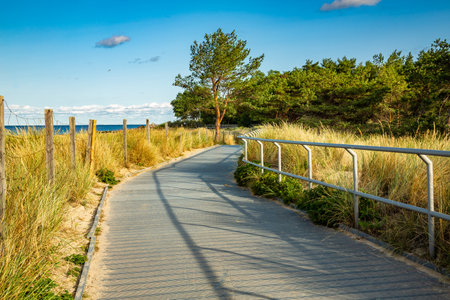 Coastal promenade along beach in Hel town on coast of Baltic Sea, Poland. Hel peninsula is popular place for summer holidays. Hel, Pomerania, Polandの写真素材