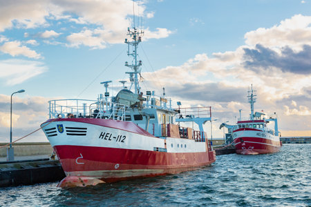 July, 09, 2022: Red and white fishing boats moored in the harbor in the town of Hel. Hel, Hel Peninsula, Baltic Sea, Pomerania, Polandのeditorial素材