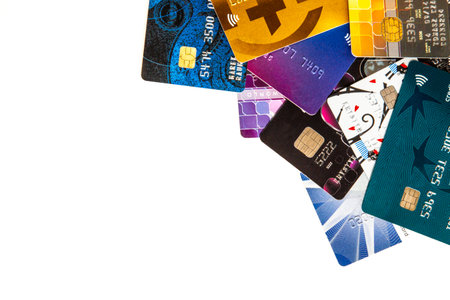 Pile of colorful various credit cards on a white background.の写真素材