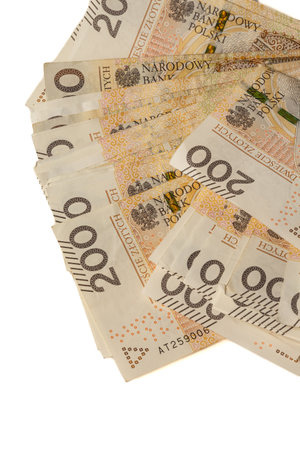 A large stack of Polish 200 zloty banknotes on a white background. Synonymous with wealth and abundance.の写真素材