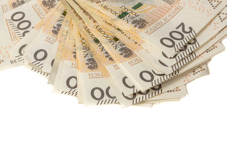 A large stack of Polish 200 zloty banknotes on a white background. Synonymous with wealth and abundance.の写真素材