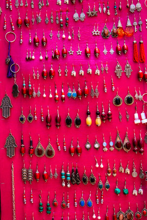 Background. Oriental jewellery. Silver and colorful traditional jewelery for sale at a roadside vendor. Moroccoの写真素材