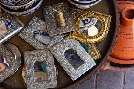 Background. Close up. Small mirrors in decorative frames. Craft souvenirs on street market. Moroccoの写真素材