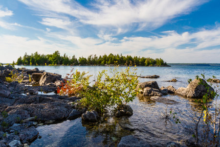 Wild rocky shoreline of Bruce Peninsula National Park near Little Dunks Bay. Lake Huron, Tobermory,...