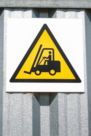 Safety sign on a construction site. Caution horizontal transport device. Polandの写真素材