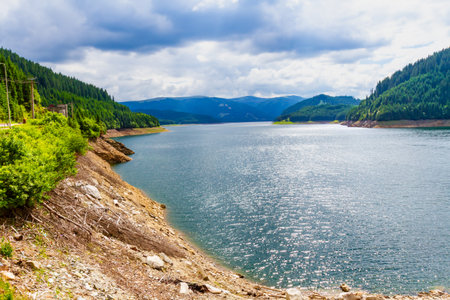 The artificial Vidraru Lake on the Arges River. FagaraÈ Mountains, Transfagarasan road, Transylvania, Romaniaの写真素材