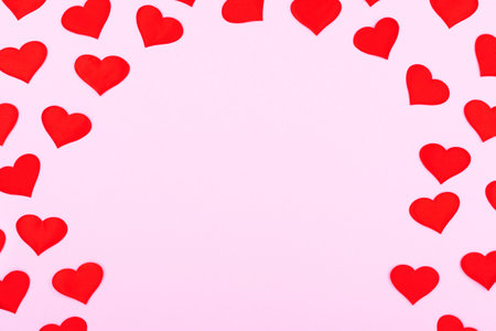 A card decorated with pattern red hearts, Valentine's Day. Celebration cards on pink background with...
