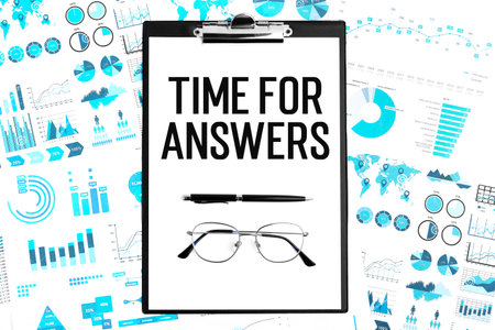 Business layout. Text TIME FOR ANSWERS on paper. Glasses, pen and clipboard.の写真素材
